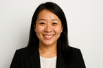 Sarah is an asian women. A portrait of hers in front of white background and she is smilling